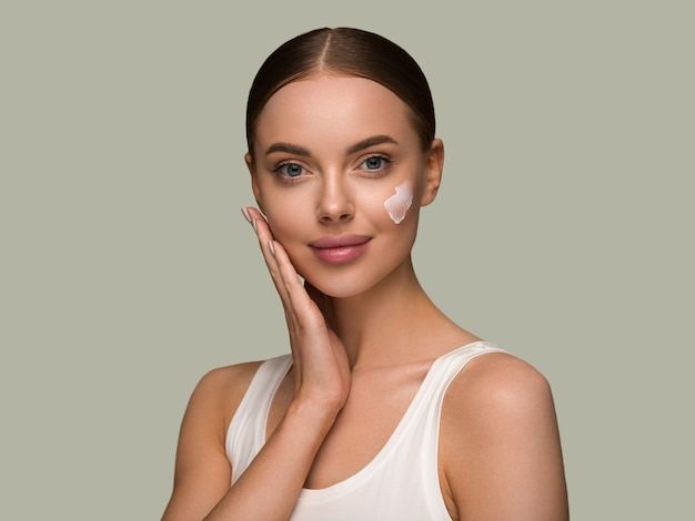 Applying winter face cream for glowing and hydrated skin
